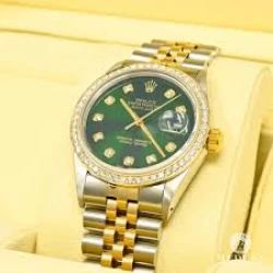 Rolex 26 mm gold face two tone with stainless steel. 18 KT YG With Diamond bezel (USED)